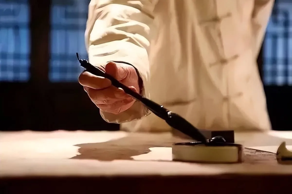 Calligraphy artist writing Chinese characters with brush