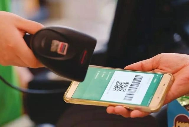 Mobile payment in China - scanning QR code with smartphone