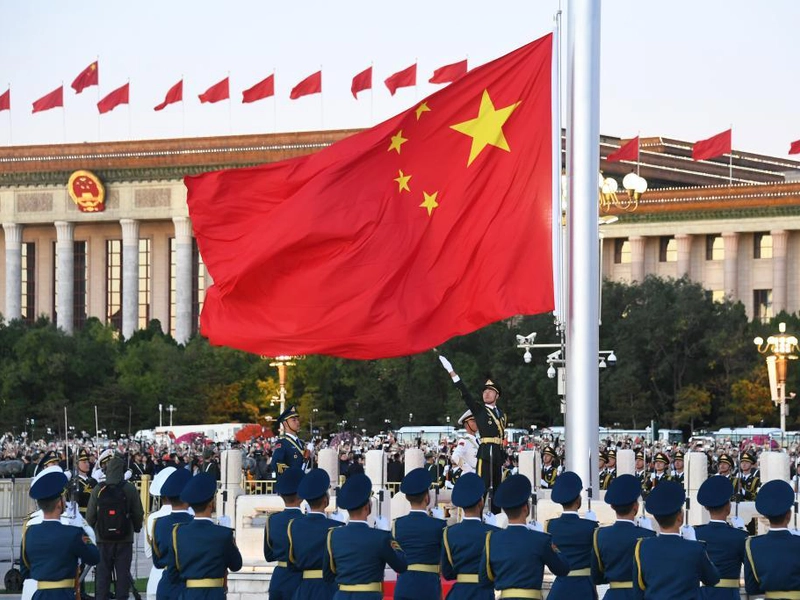 “Tiananmen Square in Beijing during China National Day, with the five-star red flag raised at dawn”