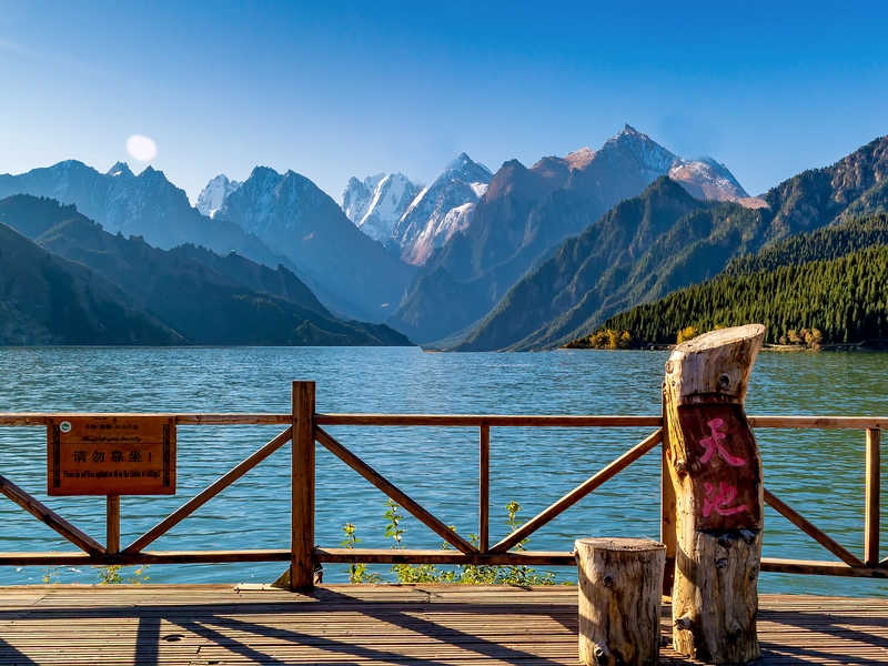Xinjiang landscape view with mountains, desert, and oasis