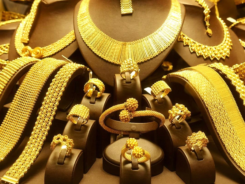 A supernova explosion, where stars forge gold elements in a brilliant death, scattering them across the cosmos.