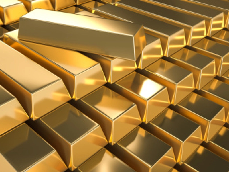 A heavily fortified modern central bank vault, where over 90% of gold is reburied, becoming silent figures in electronic ledgers.