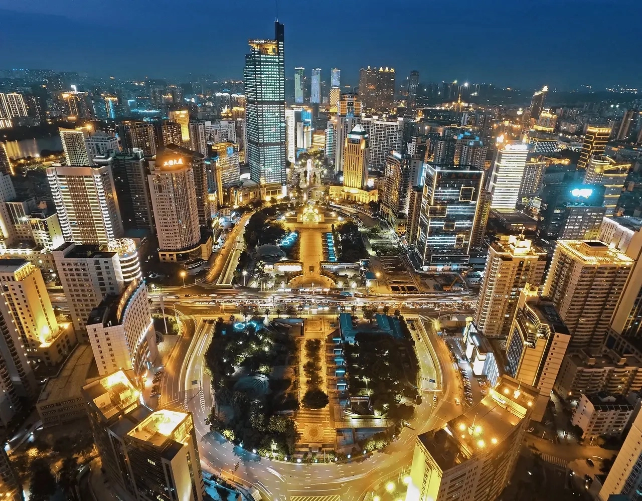 Baotou cityscape showing industrial steel plants alongside green grassland areas