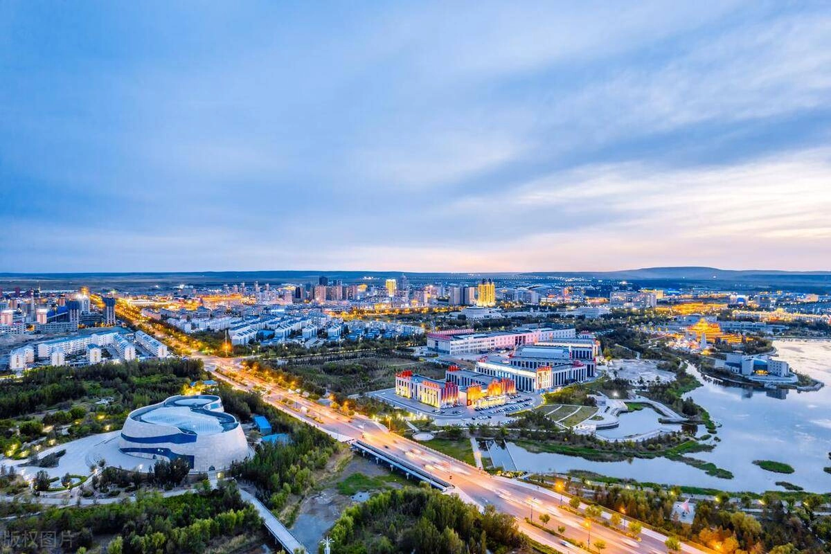 Ancient ruins of Shangdu in Xilingol with traditional Mongolian wrestlers in foreground