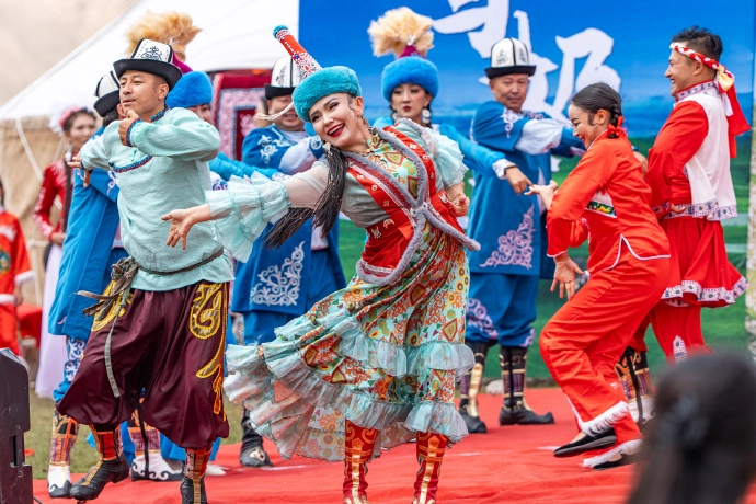 Mongolian herders preparing airag mare's milk wine during traditional festival celebration