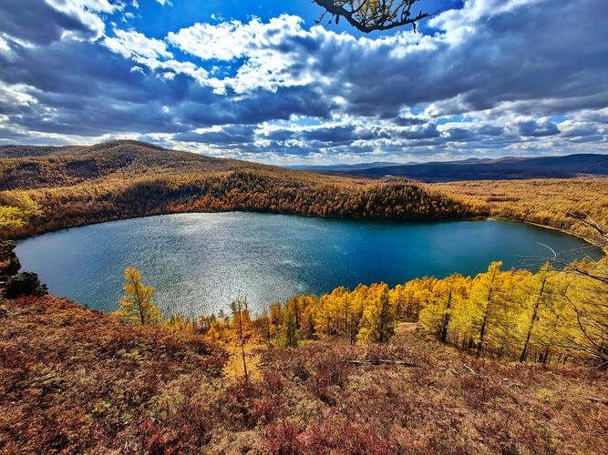 Arxan National Forest Park showing volcanic crater lakes and colorful autumn forest
