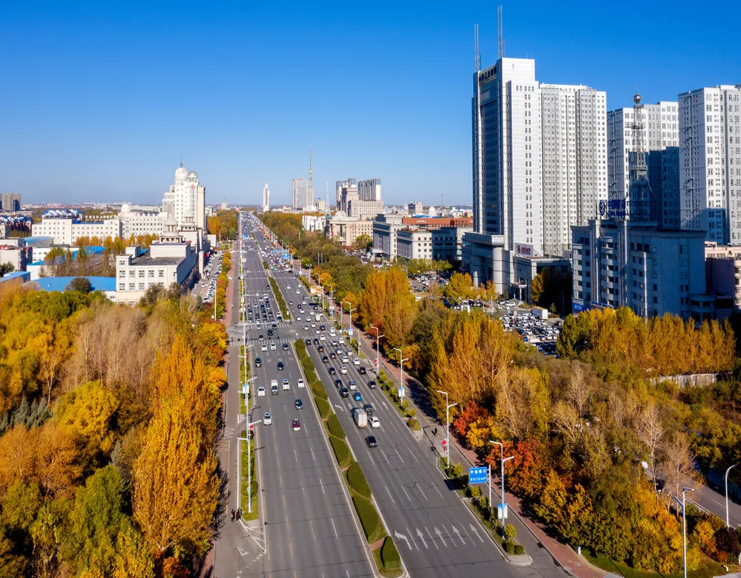 Daqing city landscape showing oil industry facilities and urban lakes with modern architecture