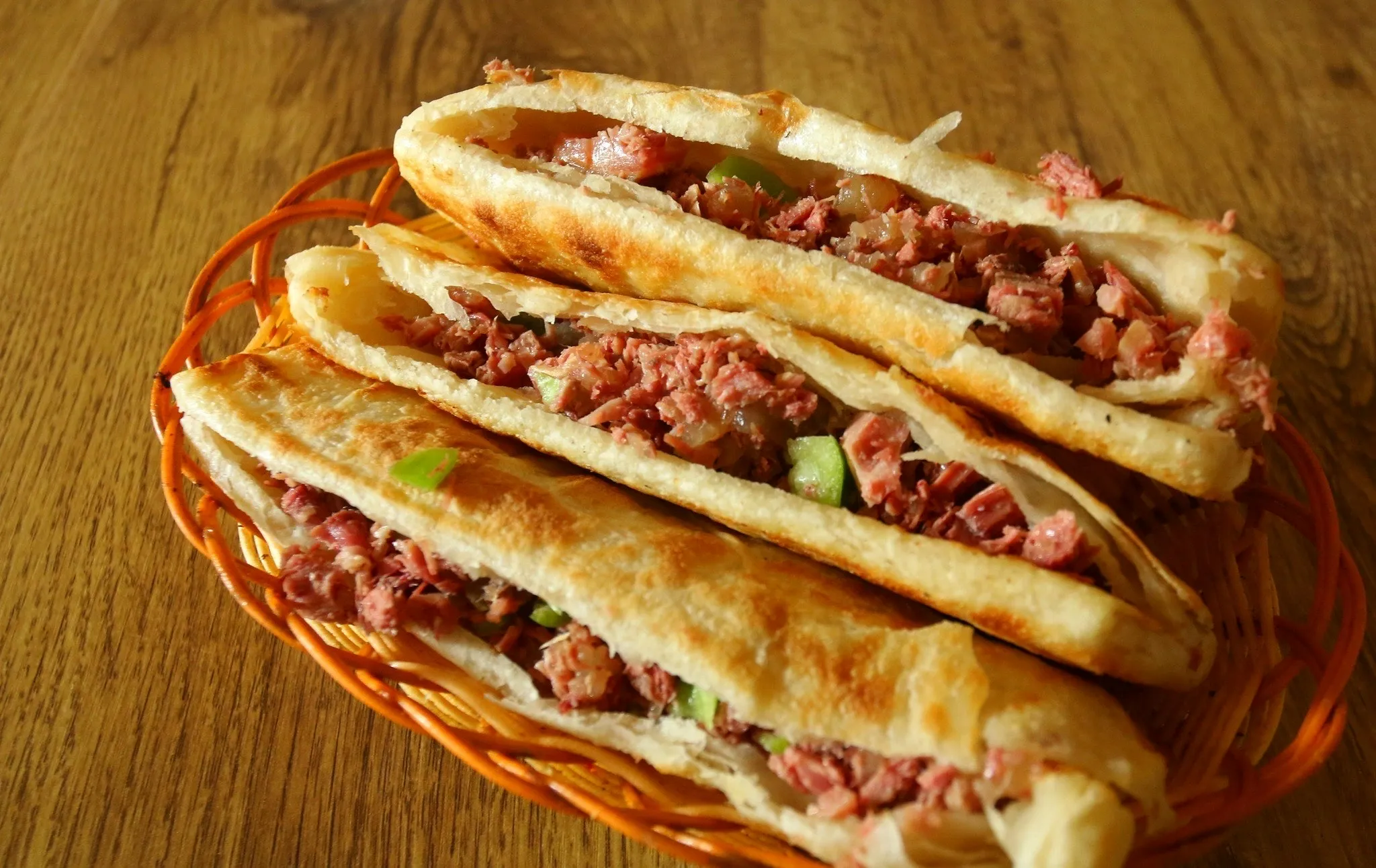 Traditional Baoding donkey burger with crispy flatbread and braised donkey meat