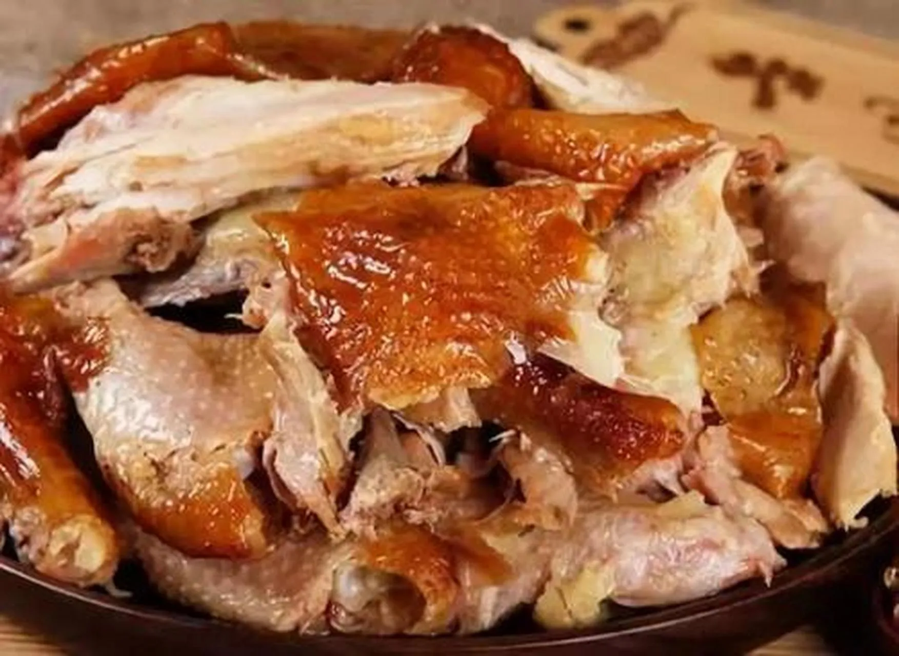 Golden Phoenix braised chicken with golden brown color and tender meat