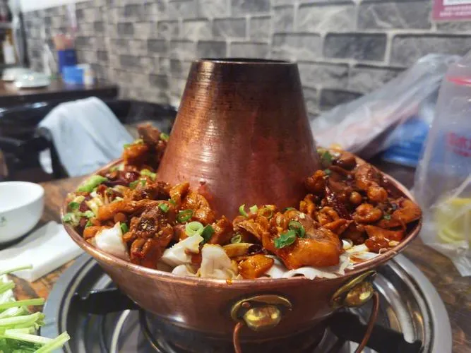 Cangzhou hot pot chicken with spicy broth and tender chicken pieces
