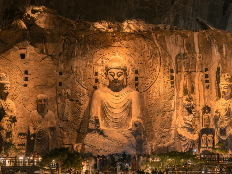 Longmen Grottoes with ancient Buddhist carvings along the river cliff