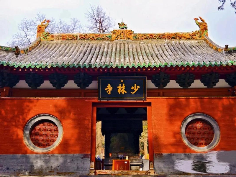 Shaolin Temple complex with traditional architecture and martial arts demonstration