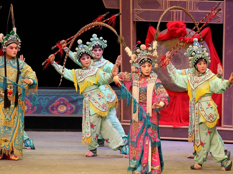 Yu Opera performance with elaborate costumes and traditional stage setting