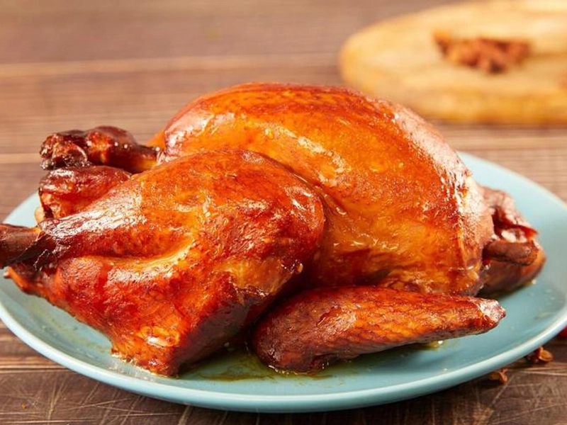 Golden brown Daokou roast chicken on plate