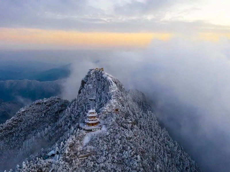 Snow-covered Longmen Grottoes with ancient Buddhist statues in winter