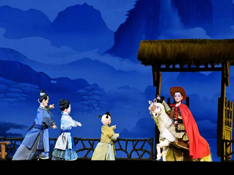 Fujian string puppetry performance with intricate puppet manipulation