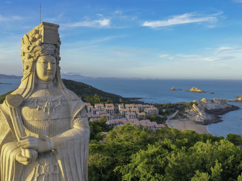 Ancestral Mazu Temple on Meizhou Island in Putian, Fujian, with rising incense and pilgrims praying for maritime safety