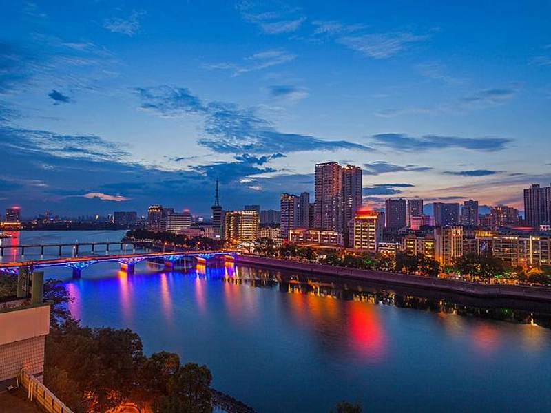 Wuyuan ancient villages with white walls and black tiles against Sanqing Mountain scenery