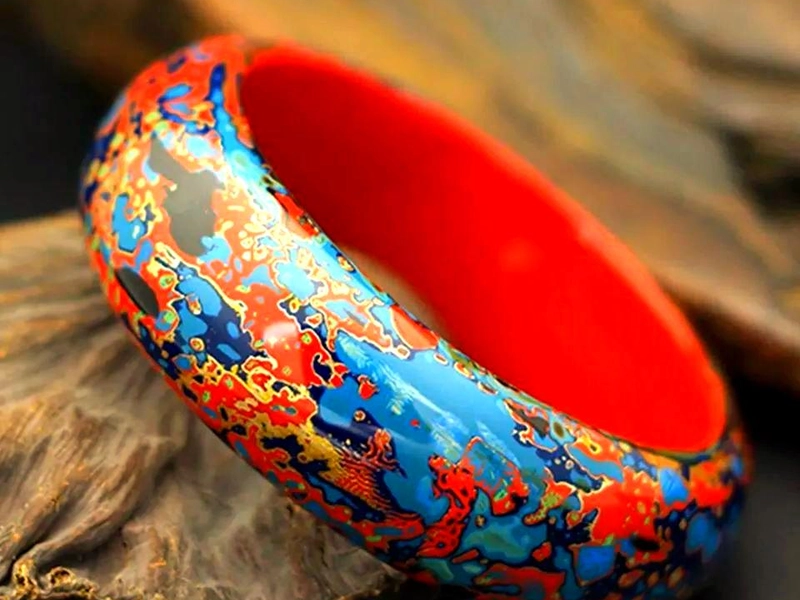 Fuzhou lacquerware pieces with vibrant colors and gilded decorations