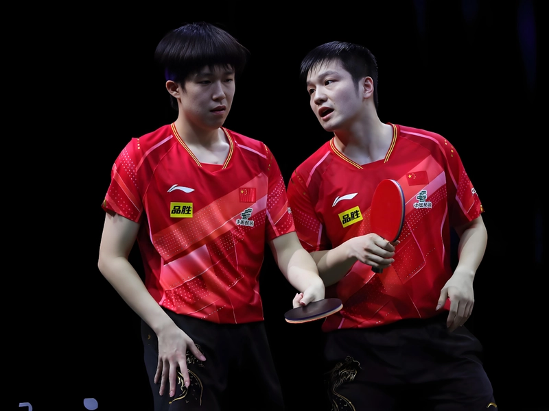 Sun Yingsha and Wang Manyu competing in women's table tennis