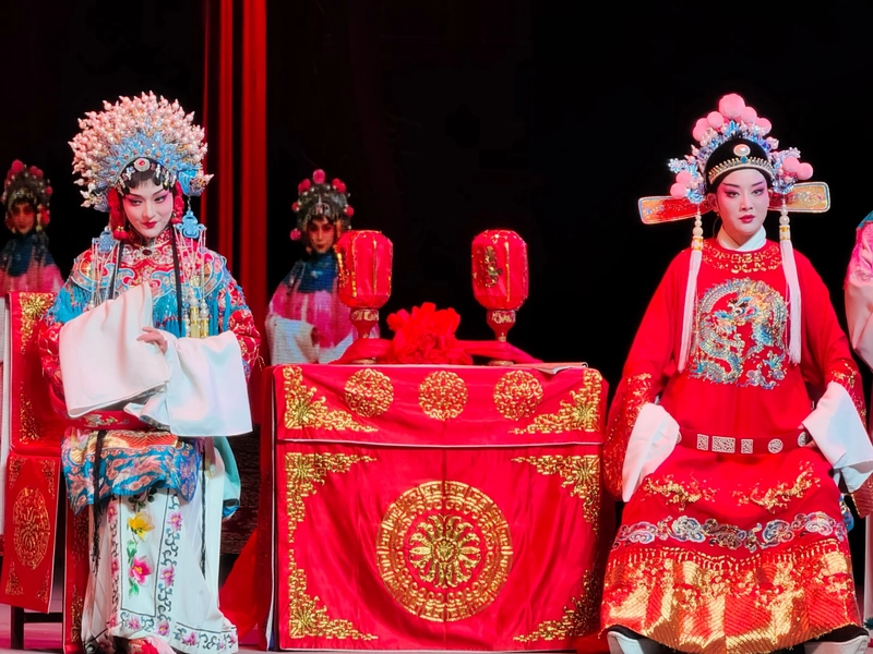 Huangmei Opera performance with traditional costumes and musical instruments