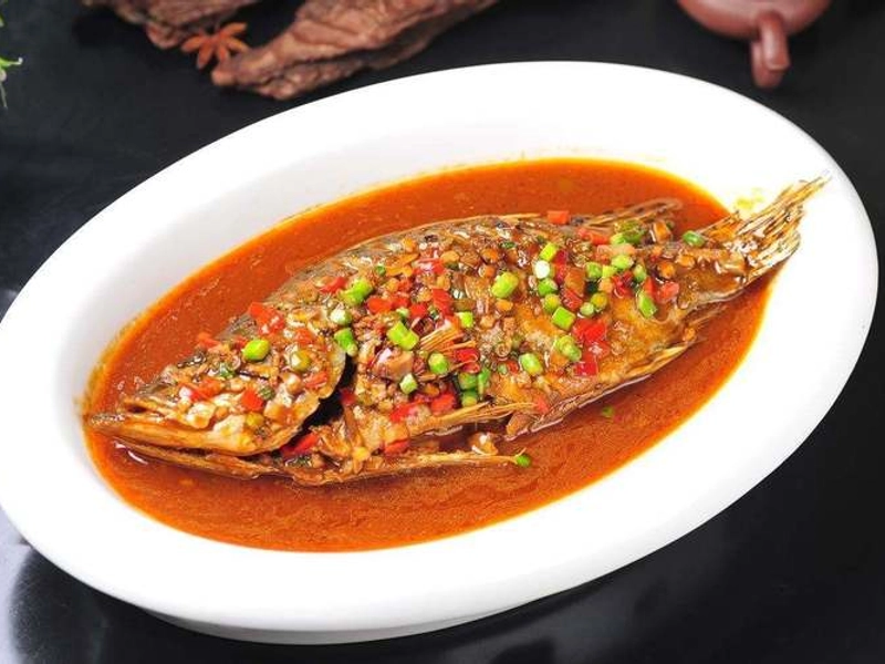 Stinky Mandarin Fish dish, delicately prepared with fermented aroma
