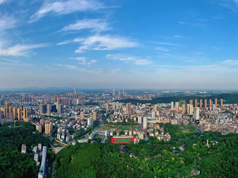Modern skyline of Jingmen with Han River in foreground