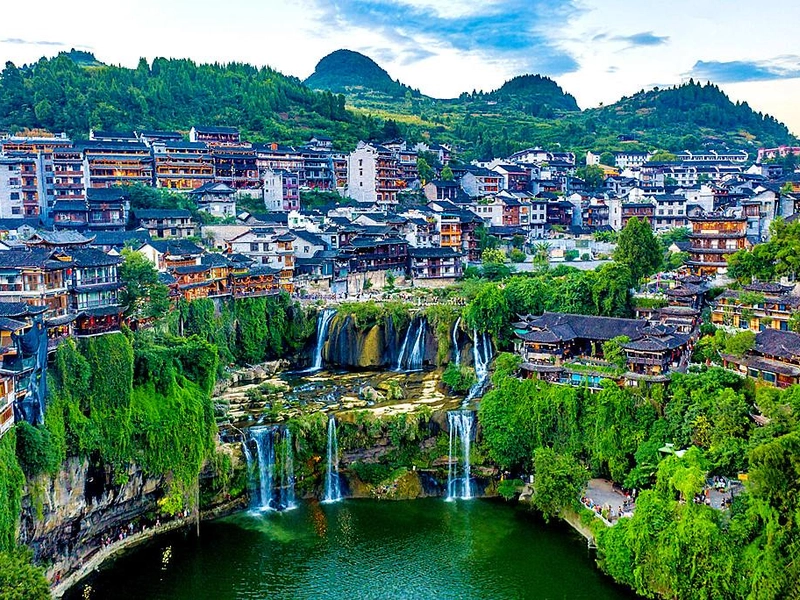 Ethnic Tujia and Miao houses with mountains in Enshi, Hubei