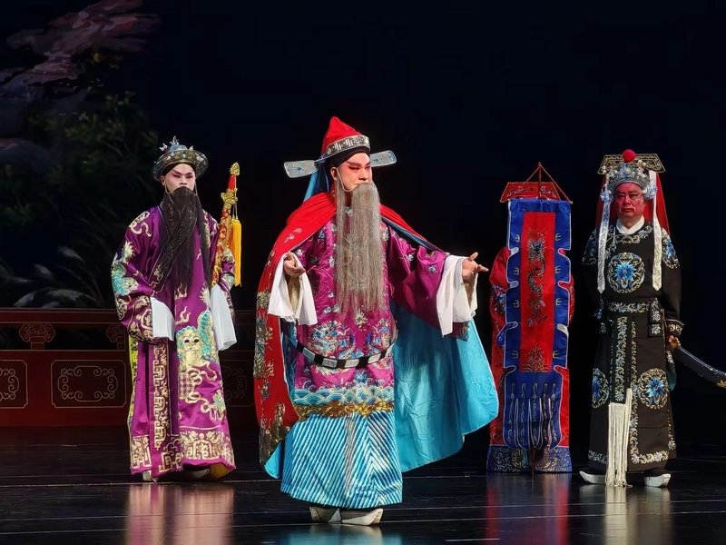 Chu Opera performers in traditional attire acting out folk stories on stage