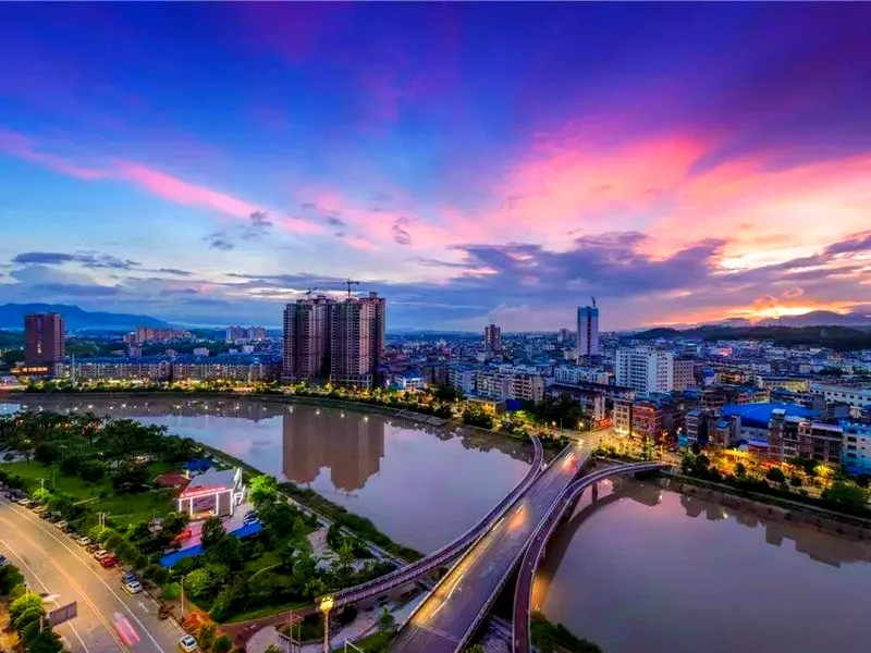 Fangchenggang coastline with mangrove wetlands and port facilities, representing its border and maritime significance