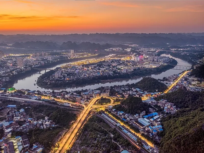 Detian Waterfall in Chongzuo with surrounding karst gorges, representing the borderland’s natural beauty and cultural significance