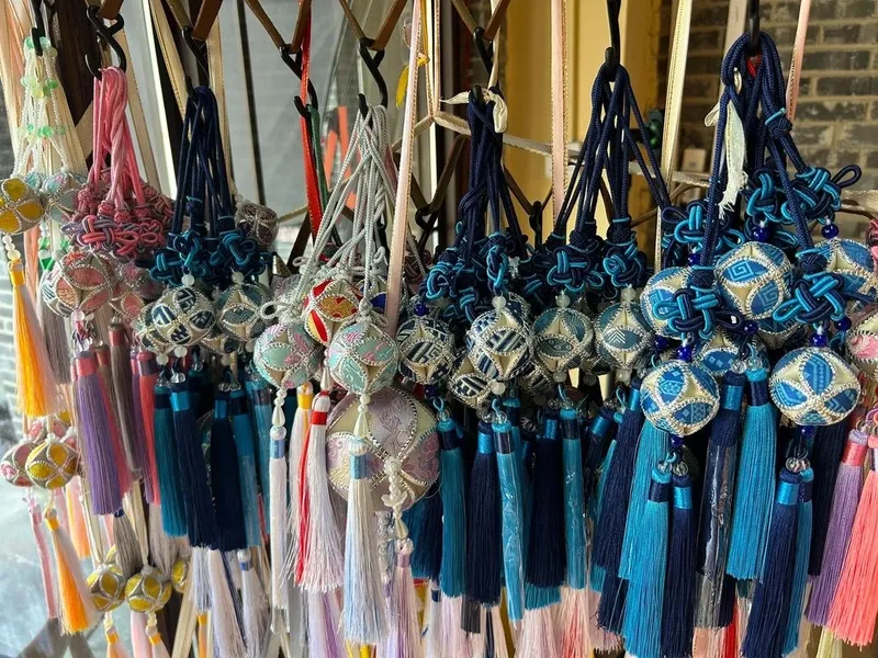 Traditional Zhuang brocade textiles with vivid colors and phoenix, sun, and bronze drum patterns