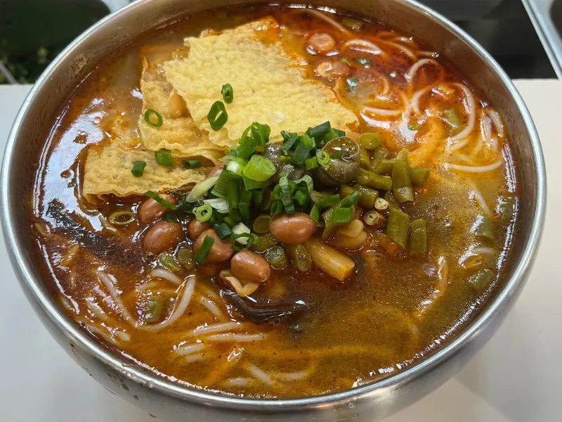 Liuzhou River Snail Noodles with stinky bamboo shoots and thick rice noodles