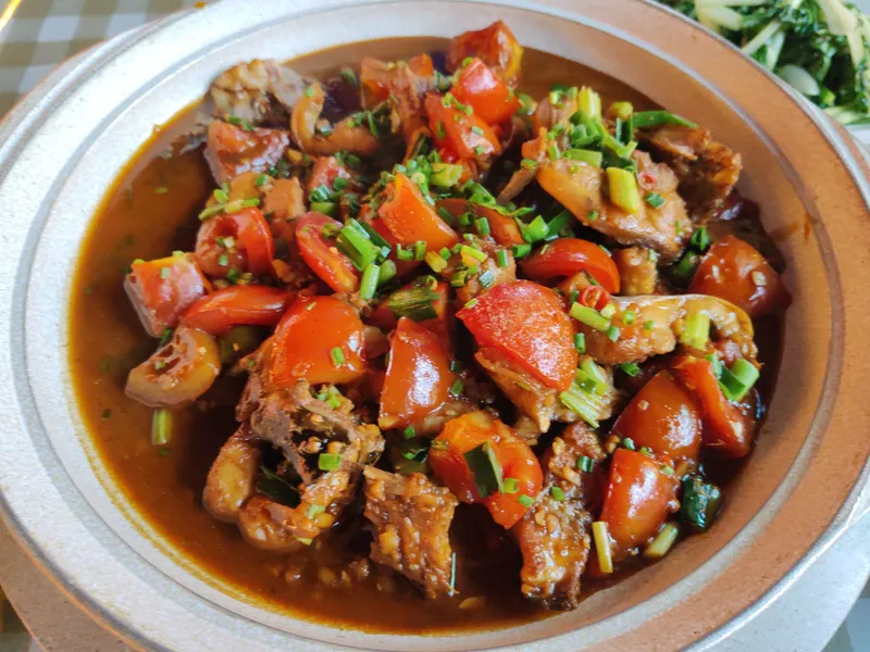 Yangshuo Beer Fish braised in local beer with tomatoes and chili