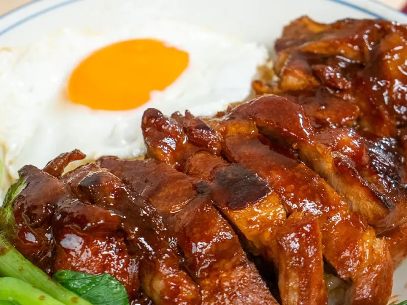 Plate of Cantonese char siu rice with caramelized pork and white rice