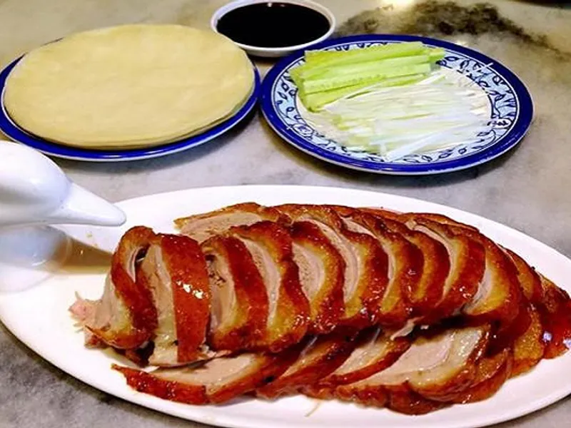 Peking Duck with thin pancakes, scallions, cucumber, and sweet bean sauce