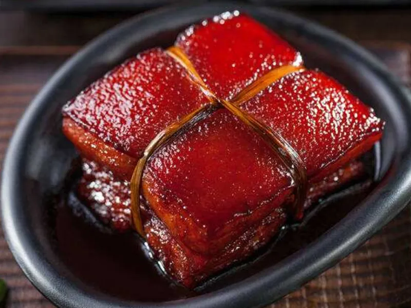 Dongpo Pork braised with rich sauce served with steamed buns or rice