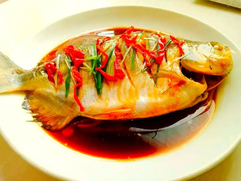 Whole steamed fish with ginger and scallion