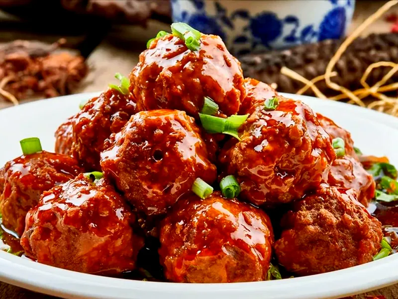 Large braised Lion’s Head pork meatballs in savory broth