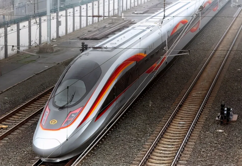 Interior view of a Fuxing high-speed train, showing comfortable seats, modern design, and advanced technology onboard.