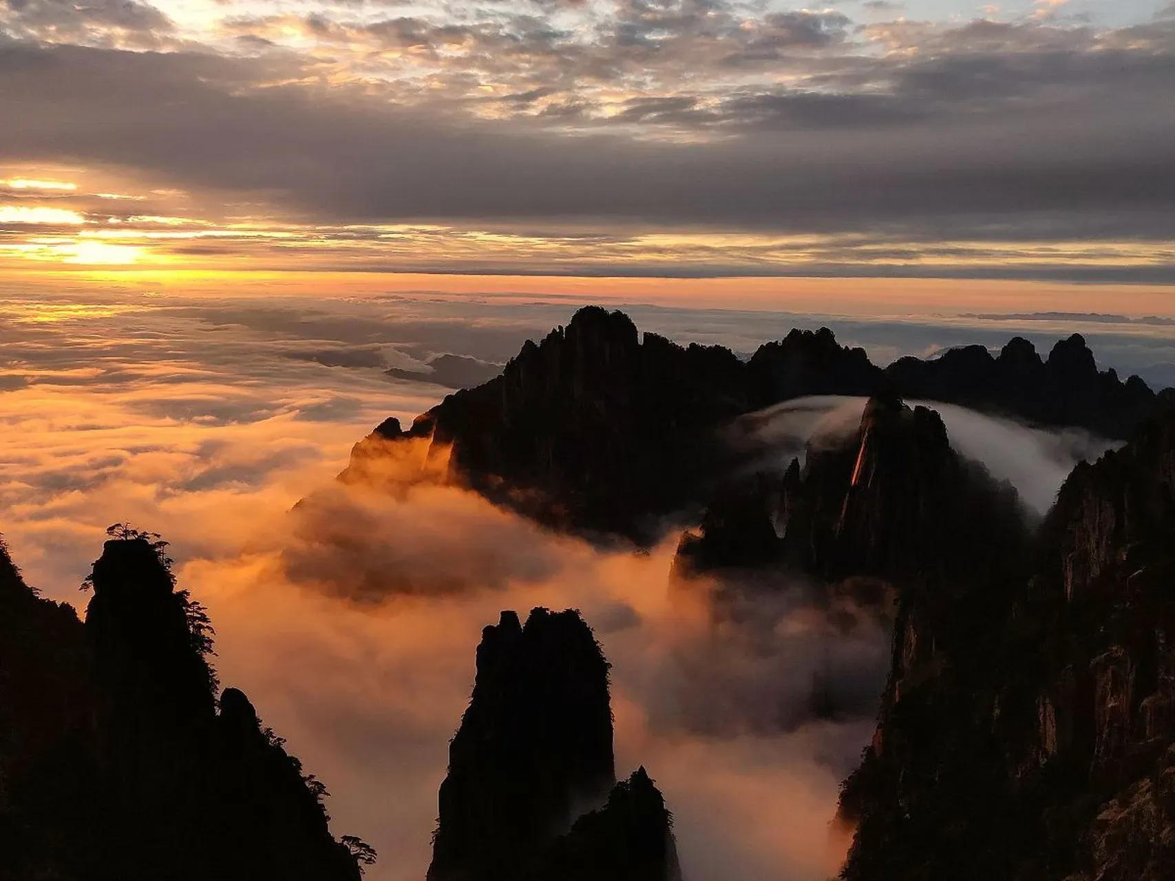 Huangshan in November, granite peaks with mist and autumn foliage