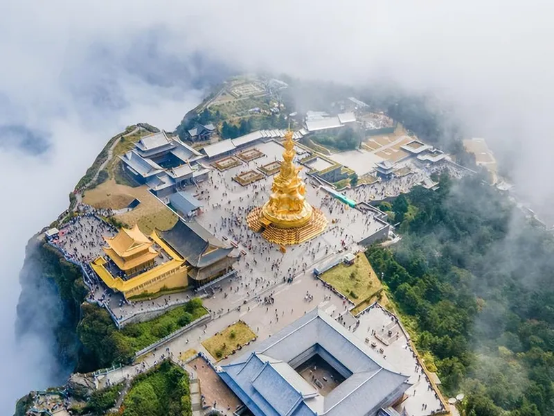Panoramic view of Mount Emei showing misty peaks, ancient temples, forest trails, and the golden statue of Samantabhadra at the Golden Summit.