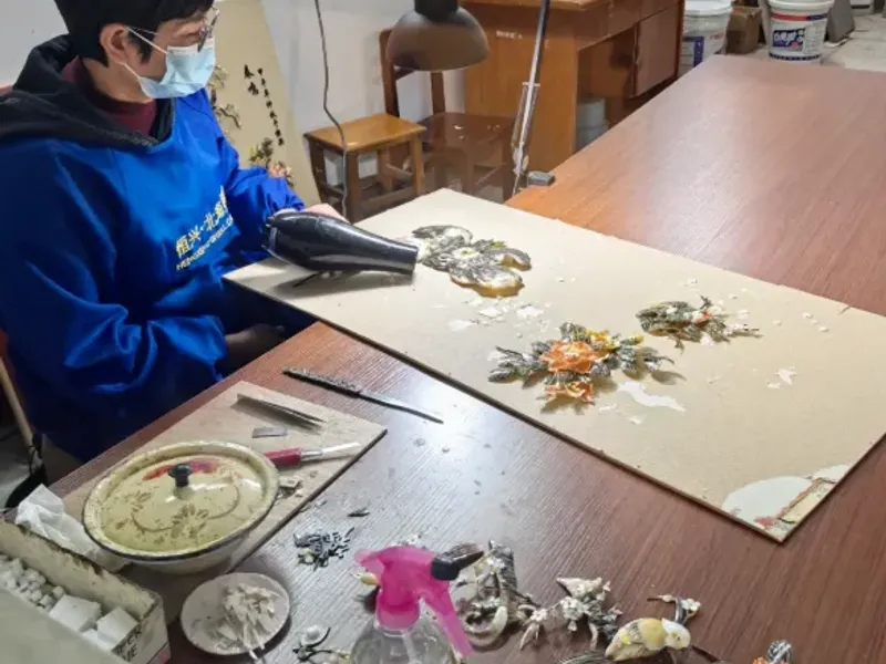 Intricate shell carving artworks at Beihai Shell Carving Museum