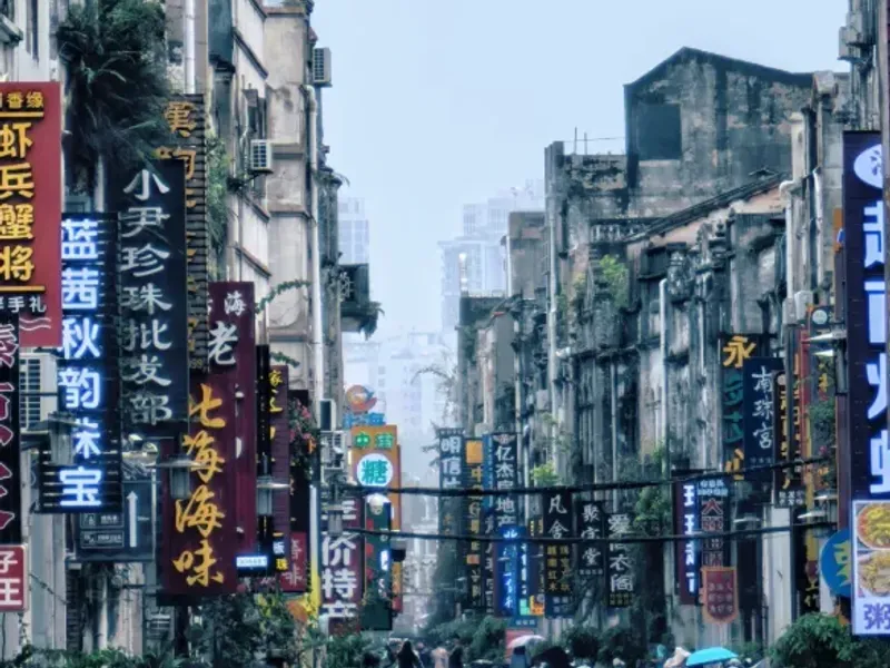 Beihai's modern development showcasing its status as one of China's 14 coastal open cities, with a blend of historic architecture and modern infrastructure.