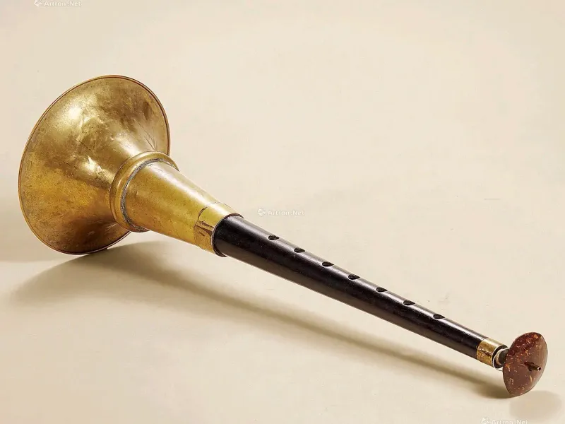 A traditional Chinese suona (唢呐) instrument, crafted from hardwood with a bamboo double reed, used in weddings, funerals, festivals, and folk music, representing Chinese musical heritage and cultural traditions.
