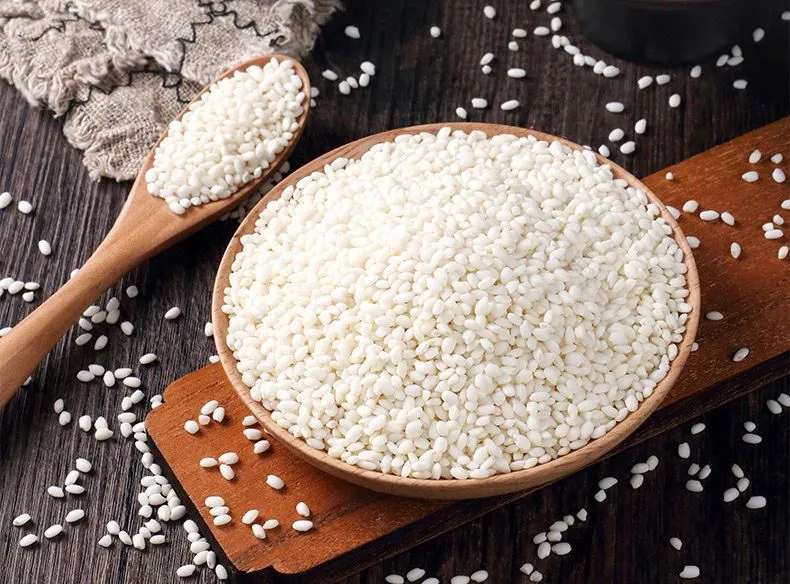 Various dishes made with sticky rice, including savory zongzi, stir-fried sticky rice, and sweet mango sticky rice