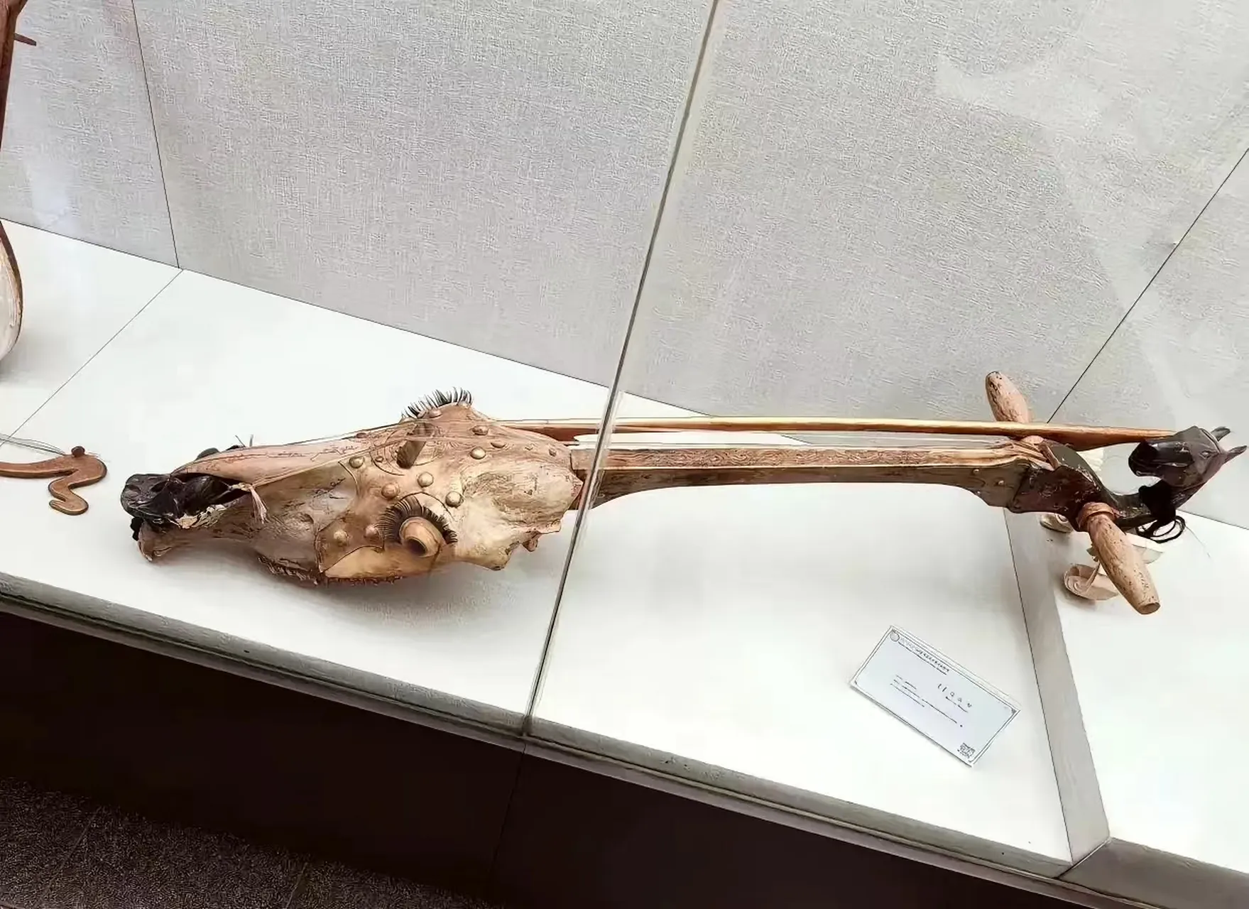 Mongolian musician playing the Morin Khuur (horse-head fiddle) on the grasslands