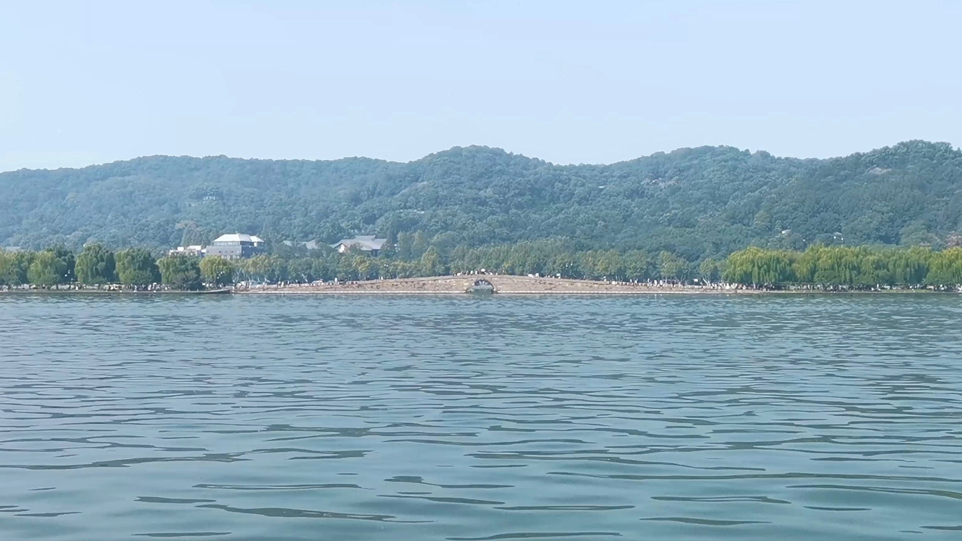 An educational visual highlighting West Lake in Hangzhou, Zhejiang Province, featuring its seasonal beauty, historic sites like Leifeng Pagoda and Lingyin Temple, famous legends such as the White Snake, surrounding attractions like Dragon Well Tea Gardens, and key vocabulary with pinyin and English translations, illustrating the natural, cultural, and mythological charm of West Lake for Chinese language and cultural learning.