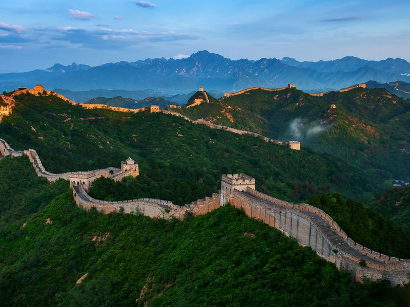 The Great Wall of China stretching across mountains, deserts, and plains, symbolizing ancient Chinese history, culture, and architectural achievement.